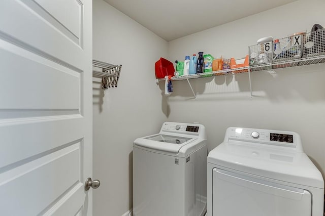 clothes washing area with laundry area and independent washer and dryer