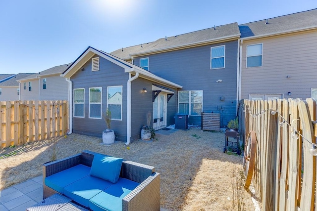 back of property with a patio area, a fenced backyard, and central air condition unit