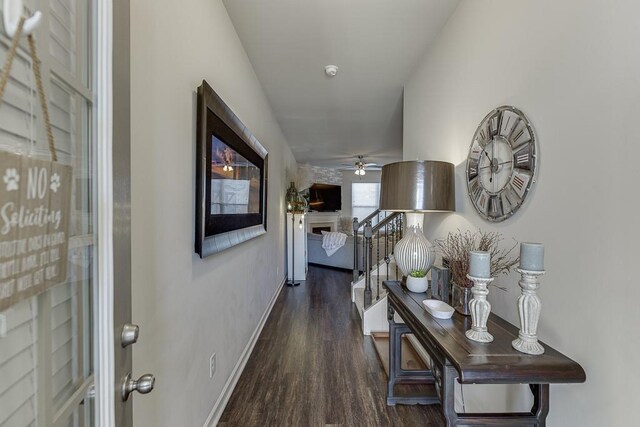 kitchen with dark wood finished floors, visible vents, open floor plan, and a sink