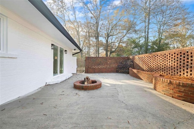 view of patio / terrace featuring an outdoor fire pit