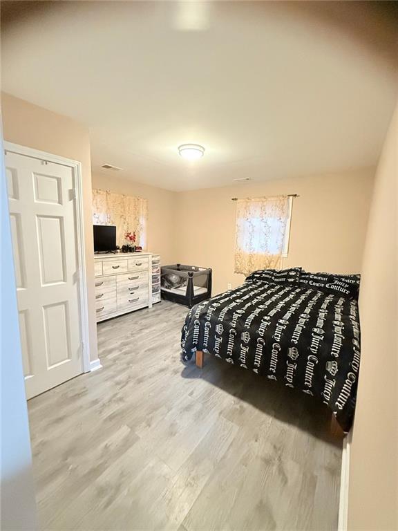 bedroom featuring light wood-type flooring