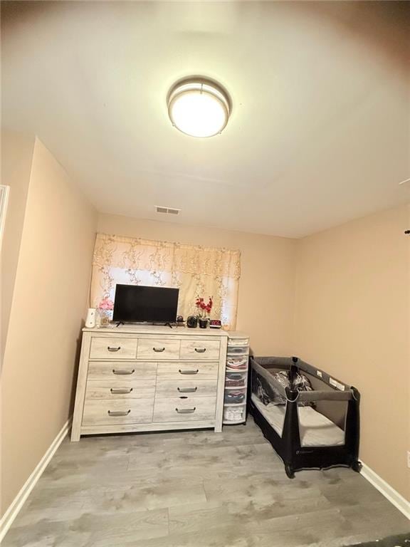 bedroom with light hardwood / wood-style flooring