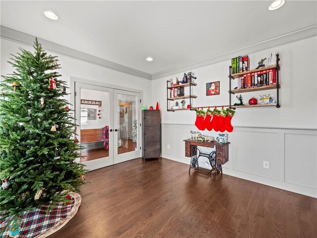 interior space with crown molding, dark wood-type flooring, and french doors