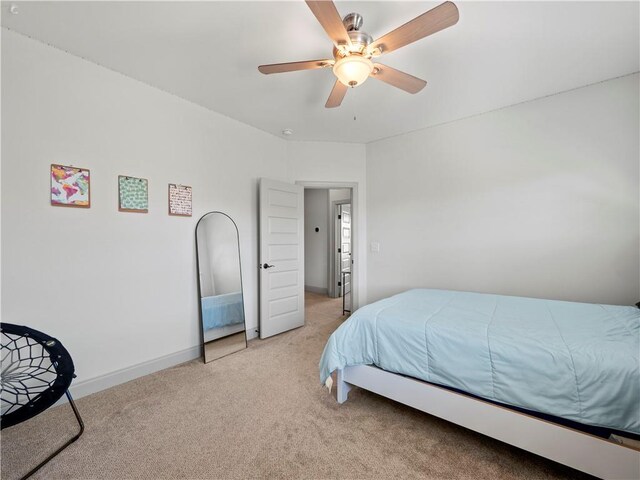 bedroom featuring ceiling fan and light colored carpet