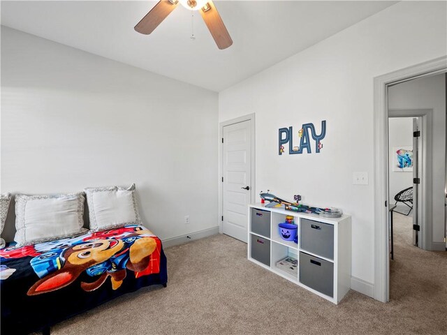 bedroom with light carpet and ceiling fan