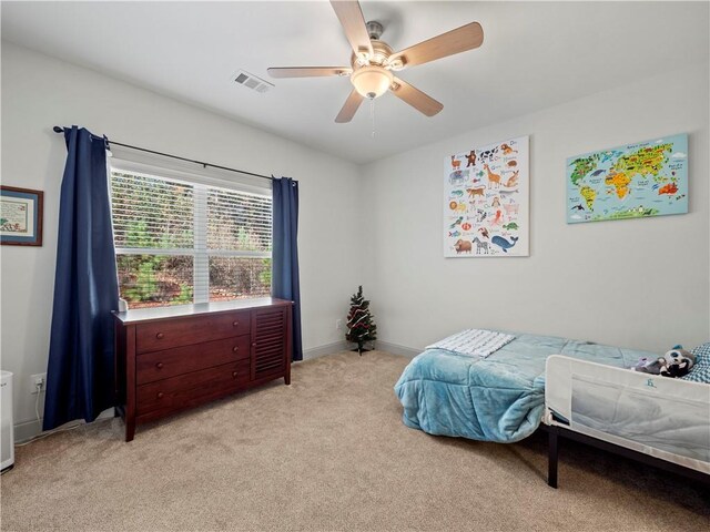 bedroom featuring ceiling fan and light colored carpet