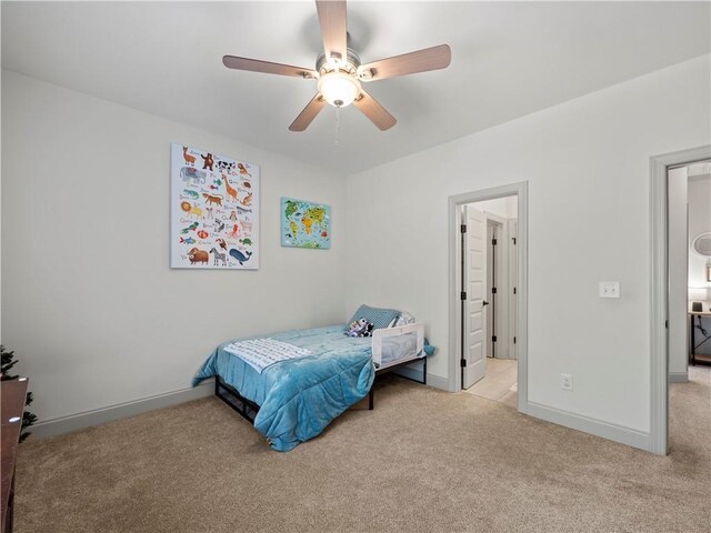 carpeted bedroom with ceiling fan