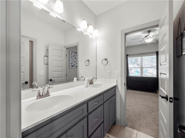 bathroom with tile patterned floors, ceiling fan, and vanity