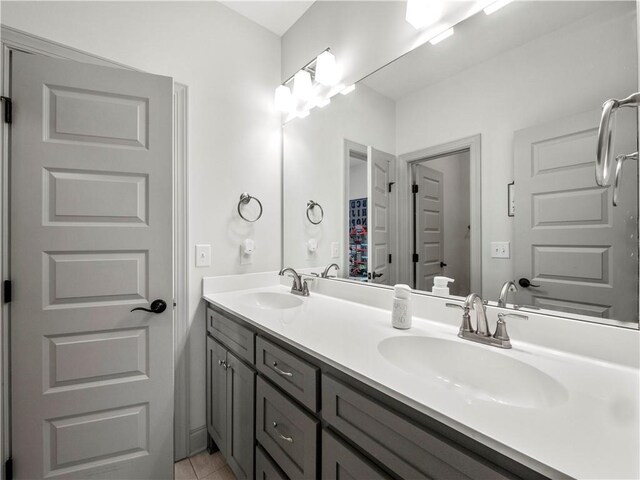 bathroom with tile patterned flooring and vanity