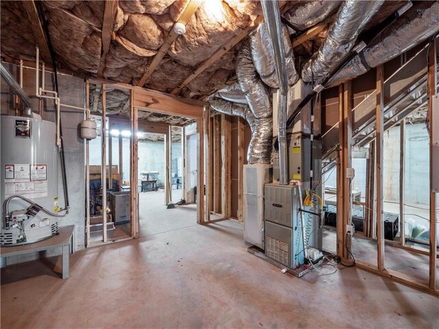 basement with heating unit and water heater