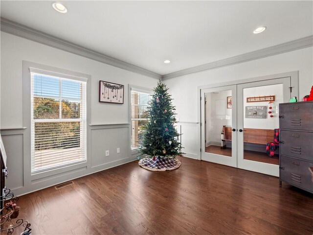 interior space featuring french doors, dark hardwood / wood-style flooring, and crown molding