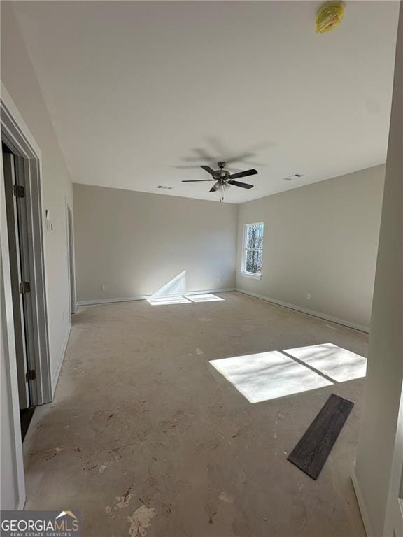 spare room with ceiling fan