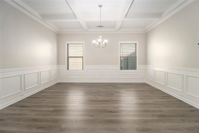 empty room featuring beamed ceiling, dark wood-type flooring, coffered ceiling, and an inviting chandelier