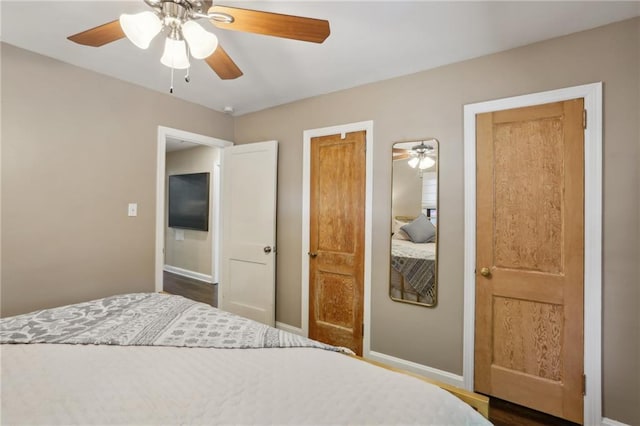 bedroom with baseboards and ceiling fan