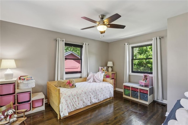 bedroom featuring wood finished floors, ceiling fan, and baseboards