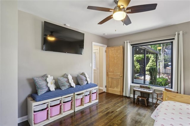 bedroom with wood finished floors, baseboards, and ceiling fan