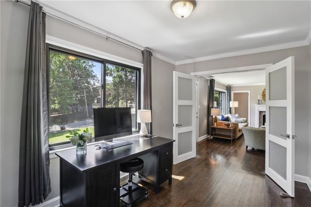 office space with plenty of natural light, hardwood / wood-style floors, crown molding, french doors, and baseboards
