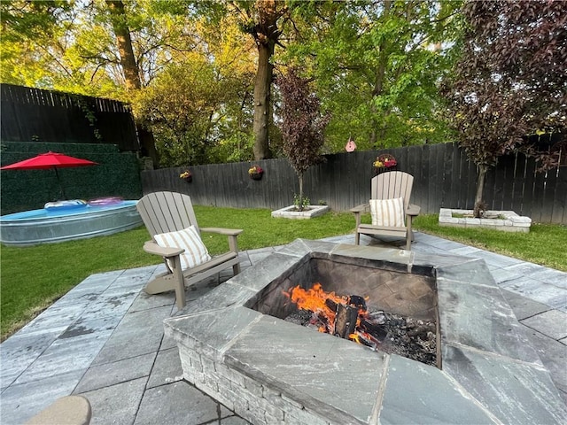 view of patio / terrace featuring a fire pit