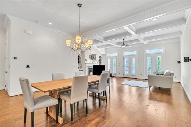 dining area featuring coffered ceiling, ceiling fan with notable chandelier, crown molding, beamed ceiling, and hardwood / wood-style floors