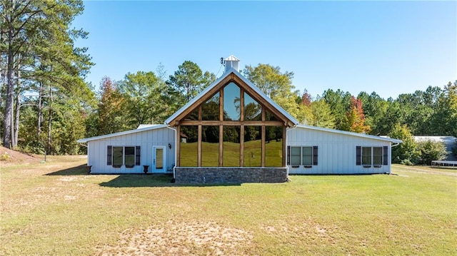 back of property with a lawn