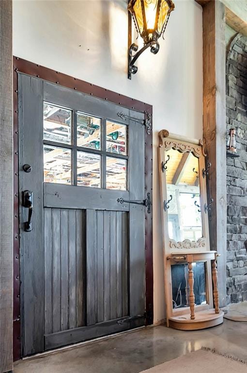 doorway to outside with concrete floors