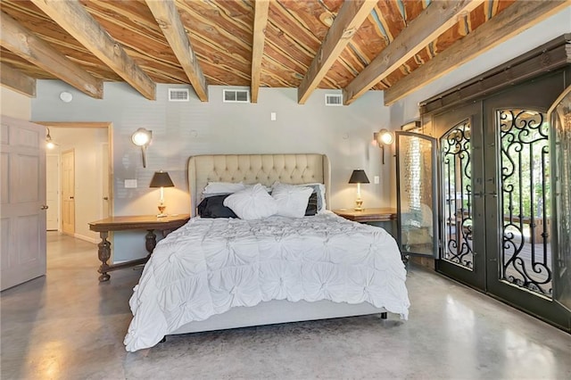 bedroom with french doors, concrete flooring, and access to outside