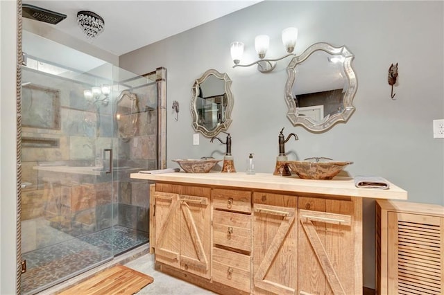 bathroom with vanity and a shower with shower door