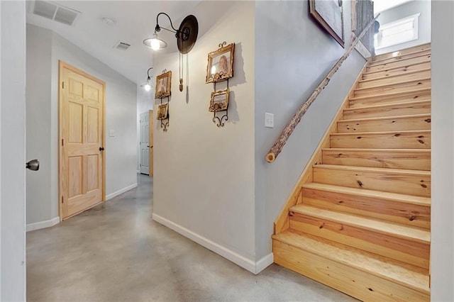 stairs with concrete floors