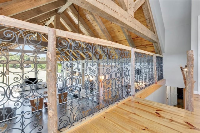 interior space with vaulted ceiling with beams, wood ceiling, and hardwood / wood-style flooring