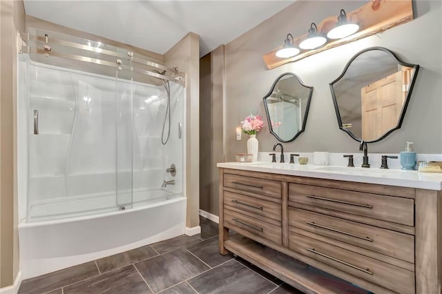 bathroom with vanity and shower / bath combination with glass door