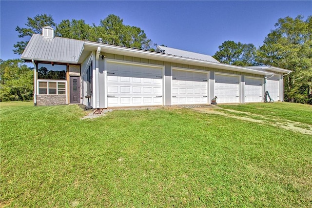 garage featuring a yard