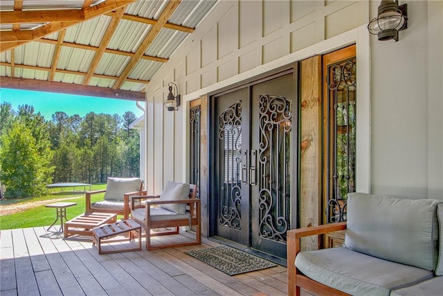 doorway to property featuring a wooden deck