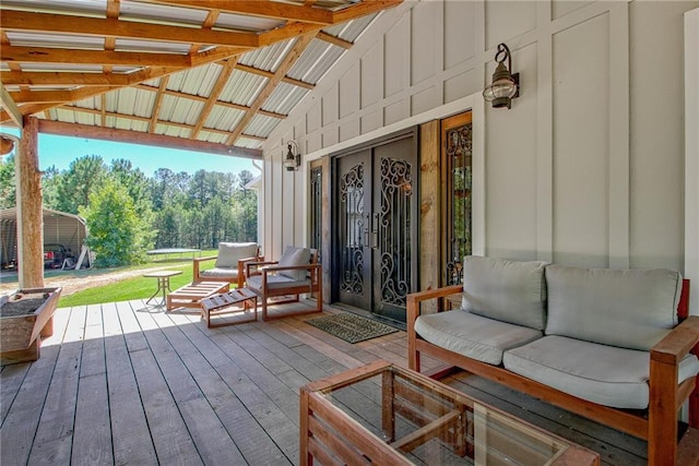 wooden deck with an outdoor living space