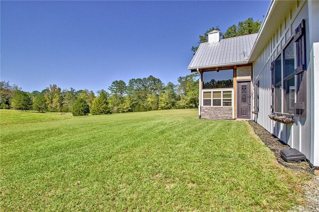 view of yard with a sunroom