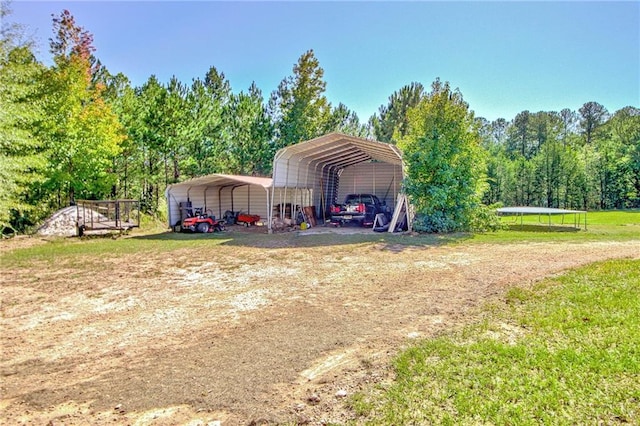 view of outbuilding featuring a carport