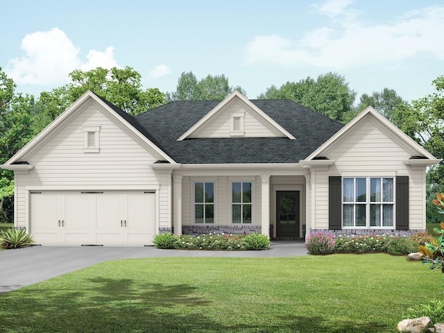 view of front of home featuring a garage and a front lawn