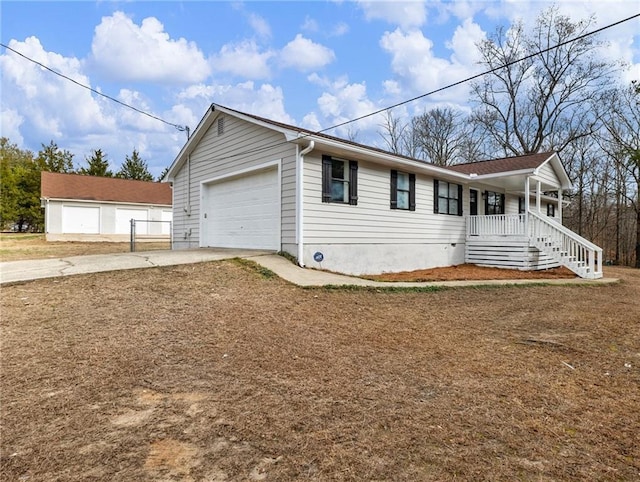 view of front of home with a porch and a garage