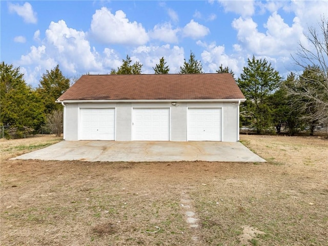 garage with a lawn