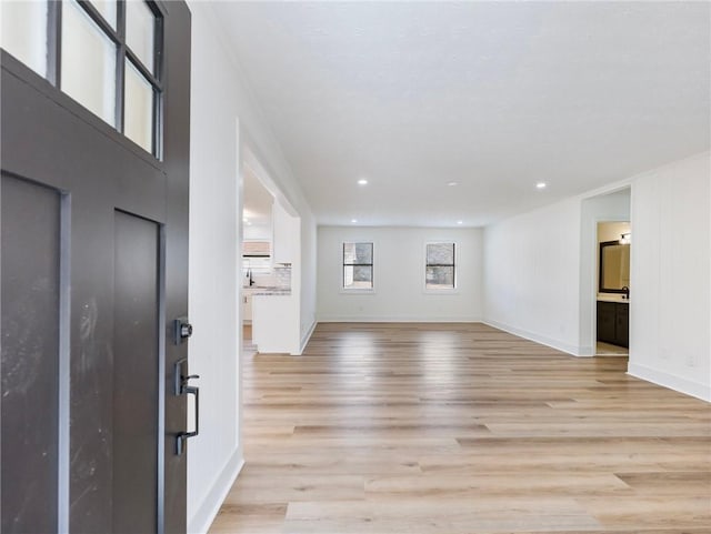 entryway with light hardwood / wood-style floors