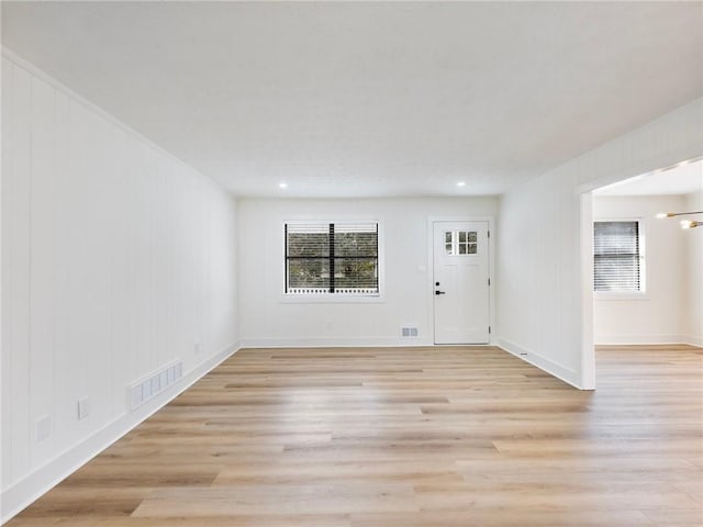 foyer with a wealth of natural light and light wood-type flooring