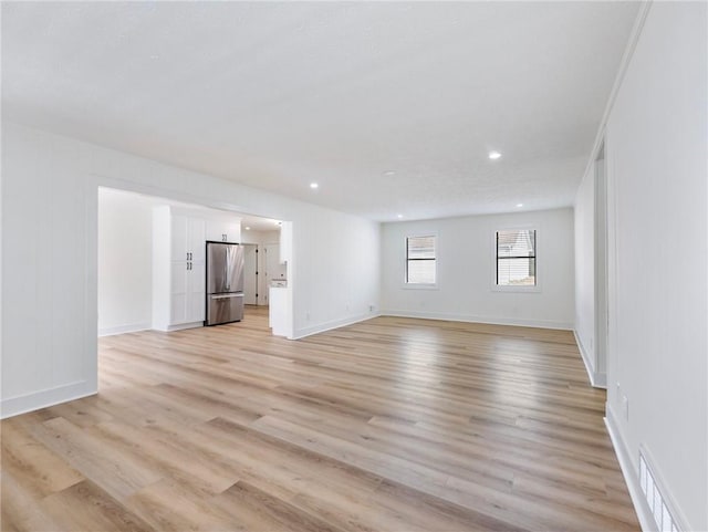 unfurnished living room with light hardwood / wood-style floors