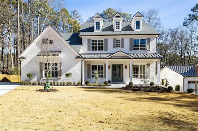 view of front facade with a porch and a front lawn