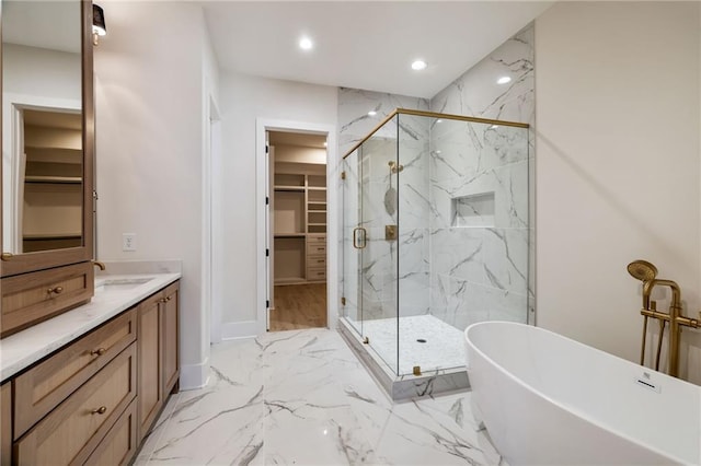 bathroom featuring vanity and shower with separate bathtub