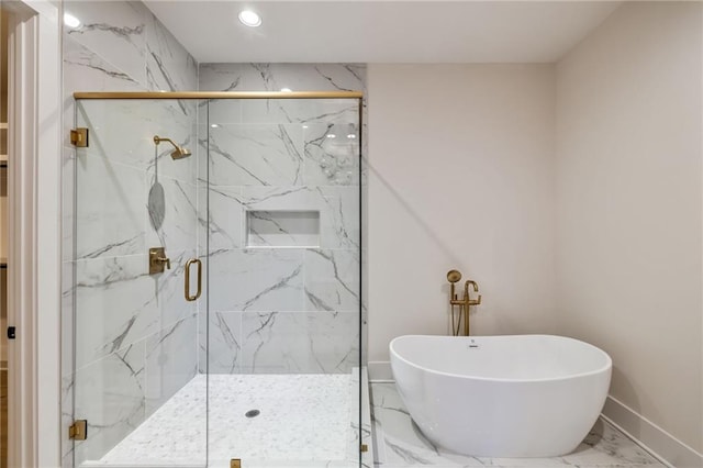 bathroom featuring separate shower and tub