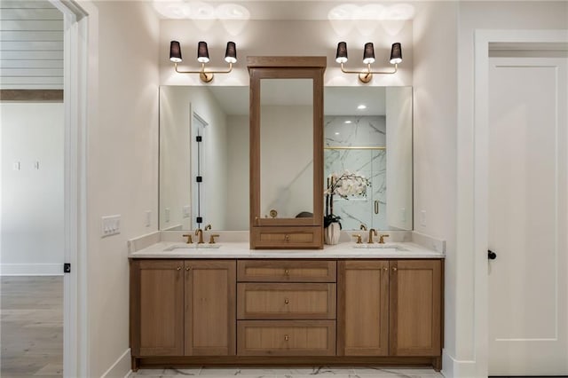 bathroom featuring walk in shower and vanity