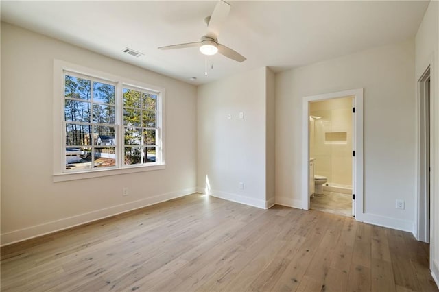 unfurnished bedroom with connected bathroom and light hardwood / wood-style flooring