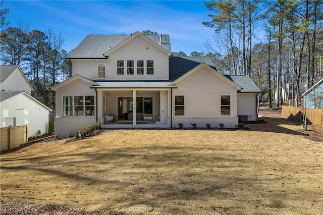 back of house featuring a yard