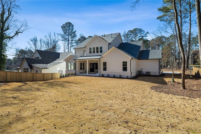 rear view of house with central AC