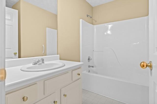 bathroom with vanity and shower / bath combination