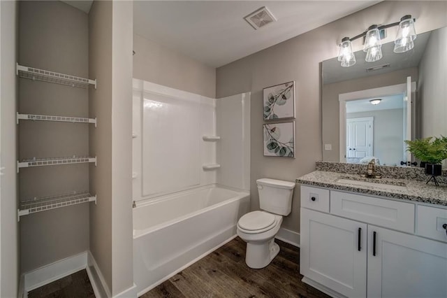 full bathroom featuring oversized vanity, shower / bathing tub combination, toilet, and wood-type flooring